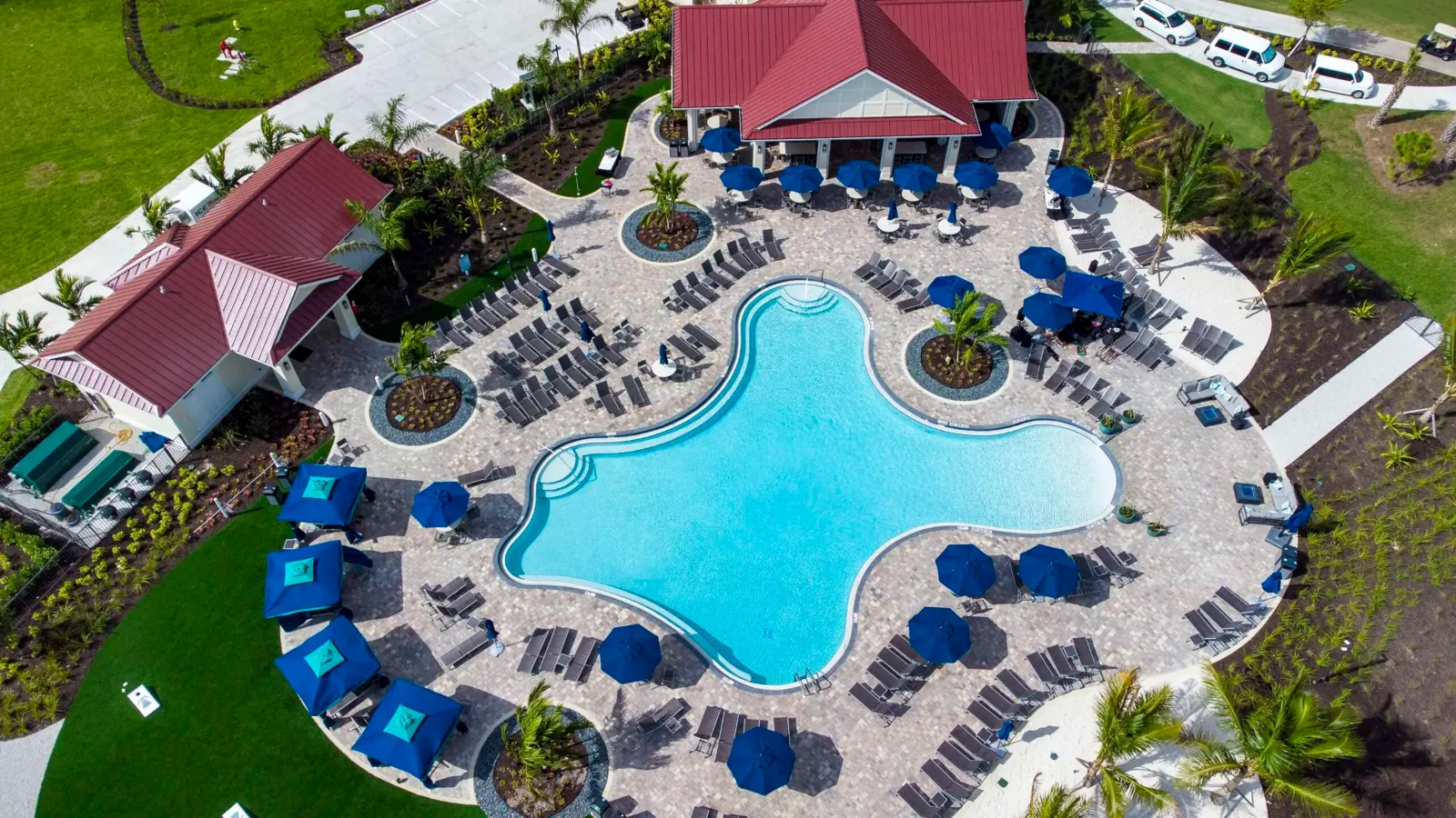 Aerial view of the lakeside pool and Bunker Bar at River Hall Country Club in Alva, Florida